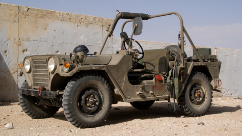 Military jeeps and other vehicle props.